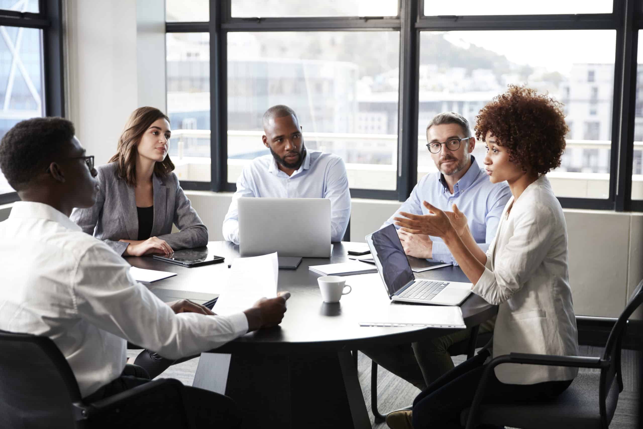 Millennial Black Businesswoman Addressing Colleagues At A Corporate Business Meeting, Close Up