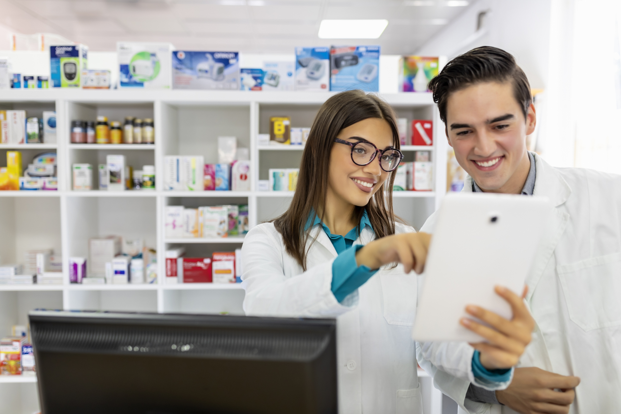 Two Cheerful Pharmacists Working Together.