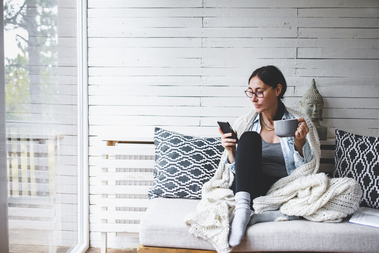 Middle Aged Woman Siting Comfortable And Enjoys Tea