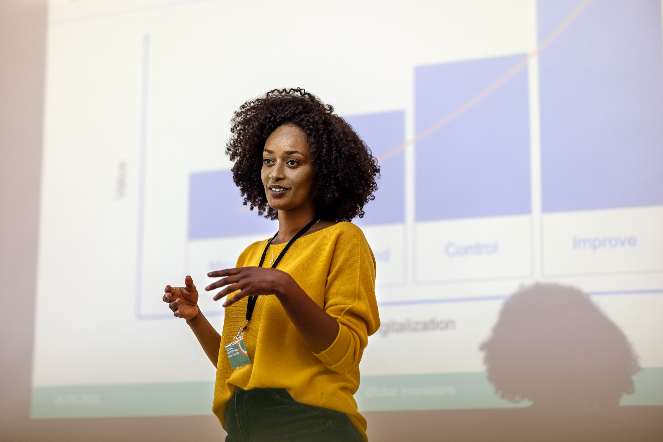 Woman entrepreneur at seminar giving presentation